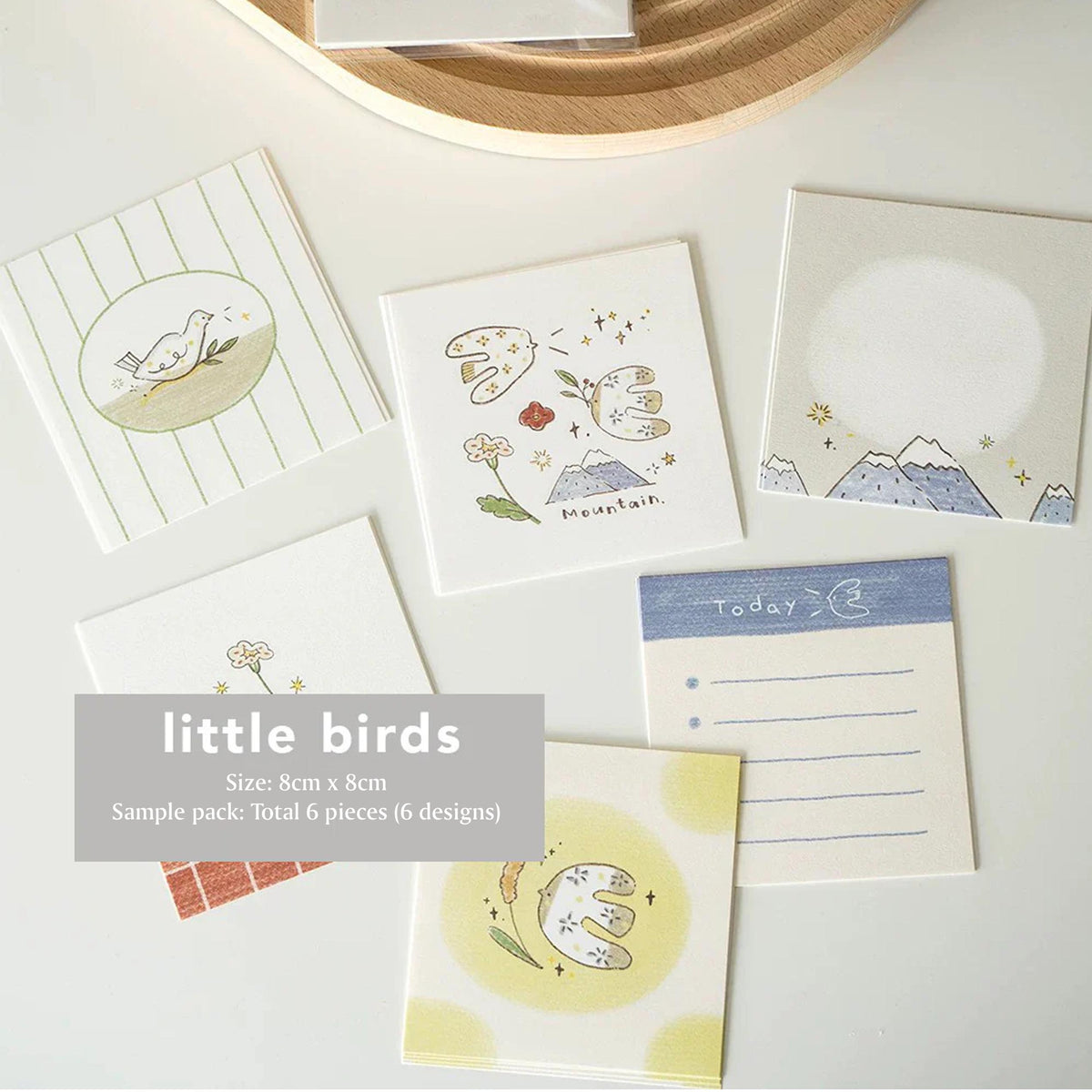 Little Birds Memo Pad set of six winter bird designs by Orange Studio on a white surface