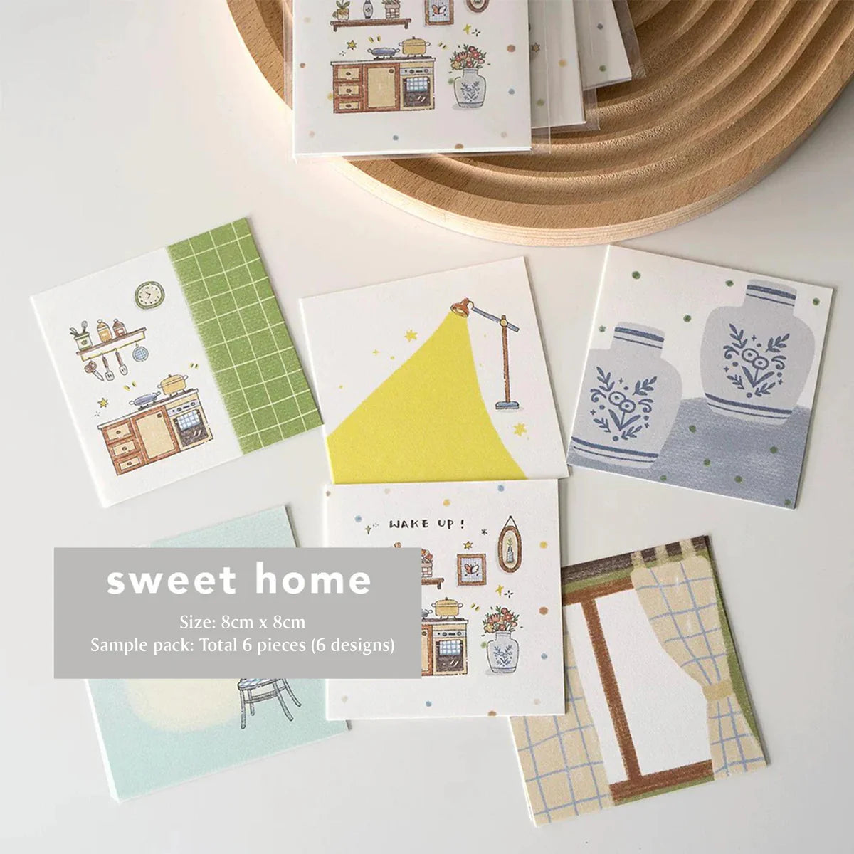 Set of small cards with home-themed illustrations on a white surface.