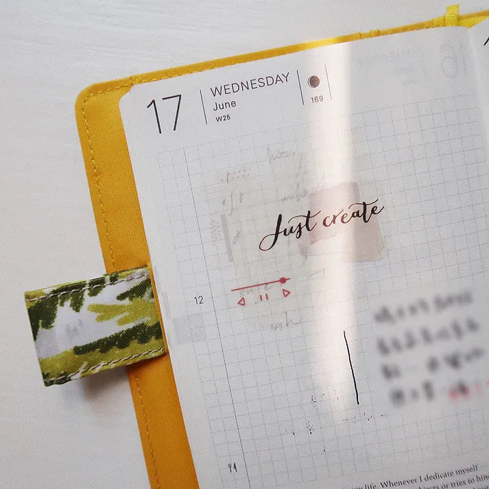 Journal styled with Messy Messy Washi Tape, a yellow ribbon and Just create lettering on white