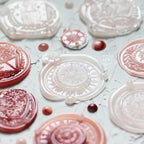 Transparent stamps with black and gray designs on a white background