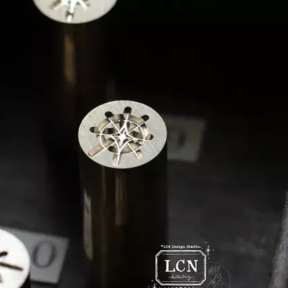 Collection of patterned paper sheets with a brand label on a white background