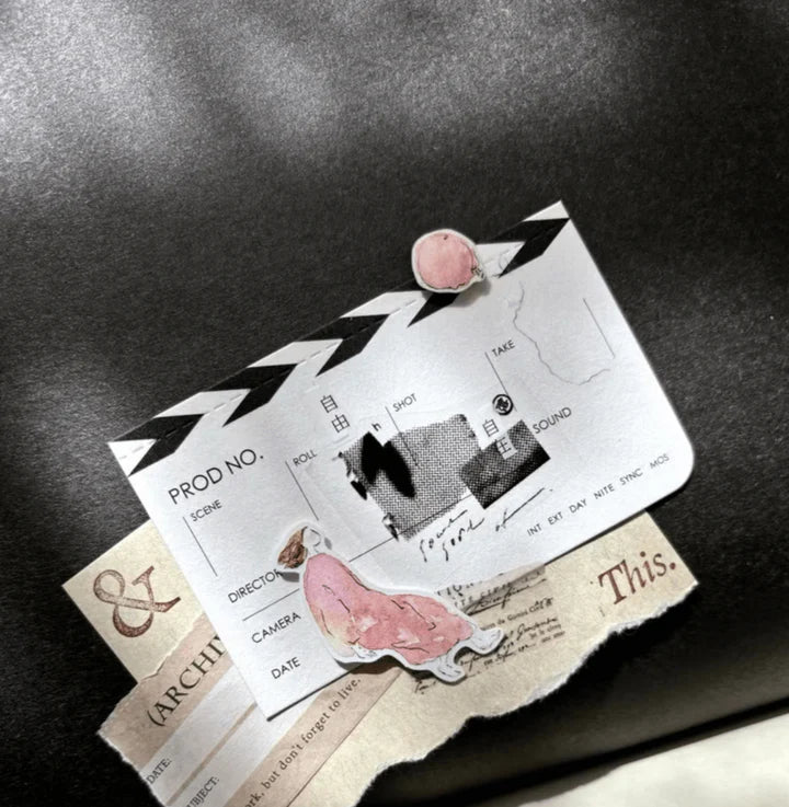 Mini Girl 01 Matte PET Tape styled with a clapperboard and pink feather on a monochrome backdrop