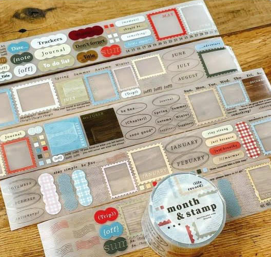 Month and Stamp PET Tape by Children Of South with assorted designs and labeled container on wood