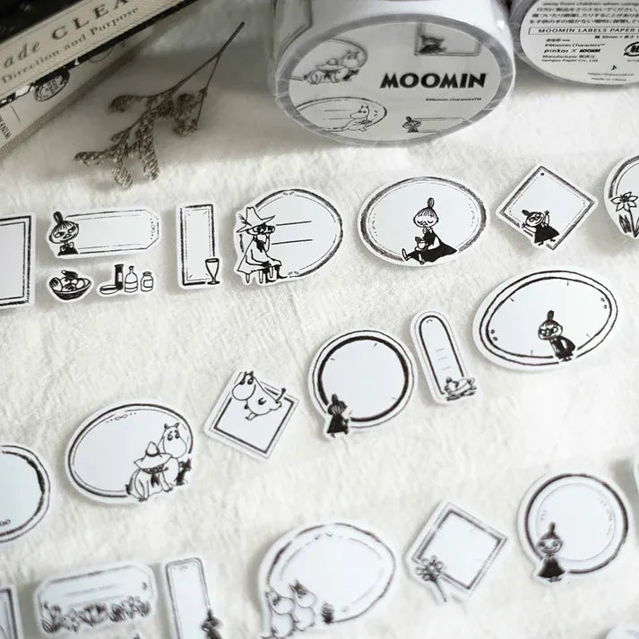 Collection of Moomin Label Sticker Tape character label designs laid out on a clean white surface