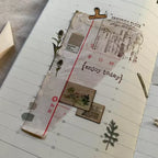 Calendar with decorative elements and text on a wooden surface