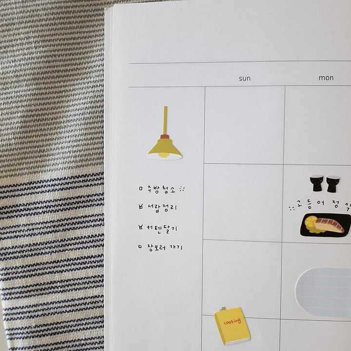 Calendar with decorative stickers on a textured surface