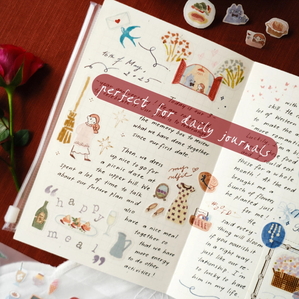Decorative stationery items with illustrations and text on a wooden surface.