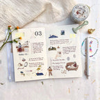 Open book with illustrations and text on a light surface with a jar and flowers.