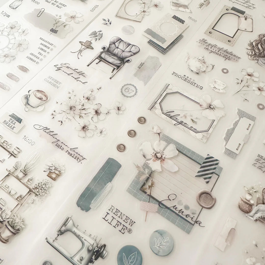 Patterned paper with various illustrations and text on a light background