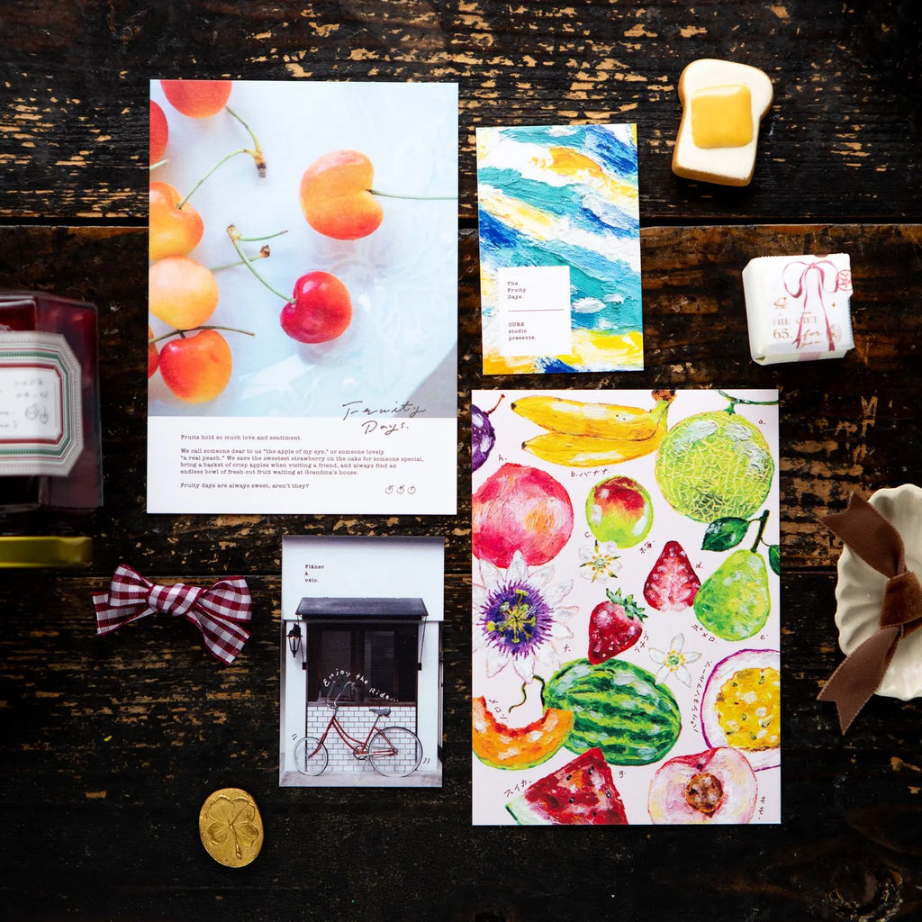 OURS Studio 2027 Journal flat-lay with fruit cards and a watercolor fruit sheet