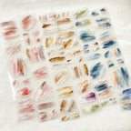 Two sheets of watercolor brush stroke stickers on a white background