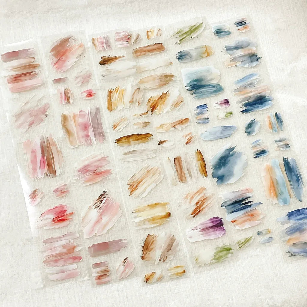 Two sheets of Oil Painting PET Tape brush stroke sticker designs on a white background