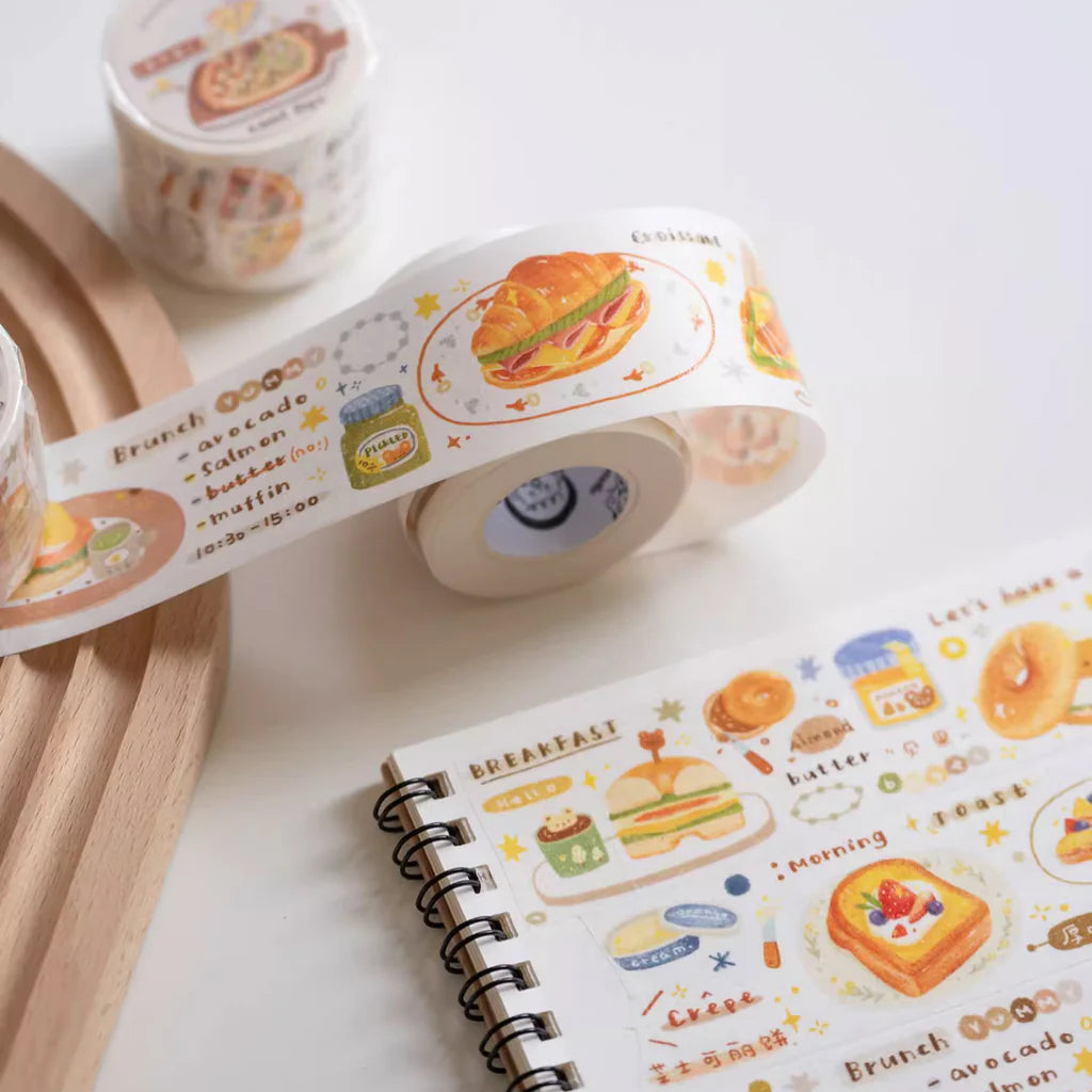 Breakfast Washi Tape by Orange Studio with playful food illustrations applied across a notebook