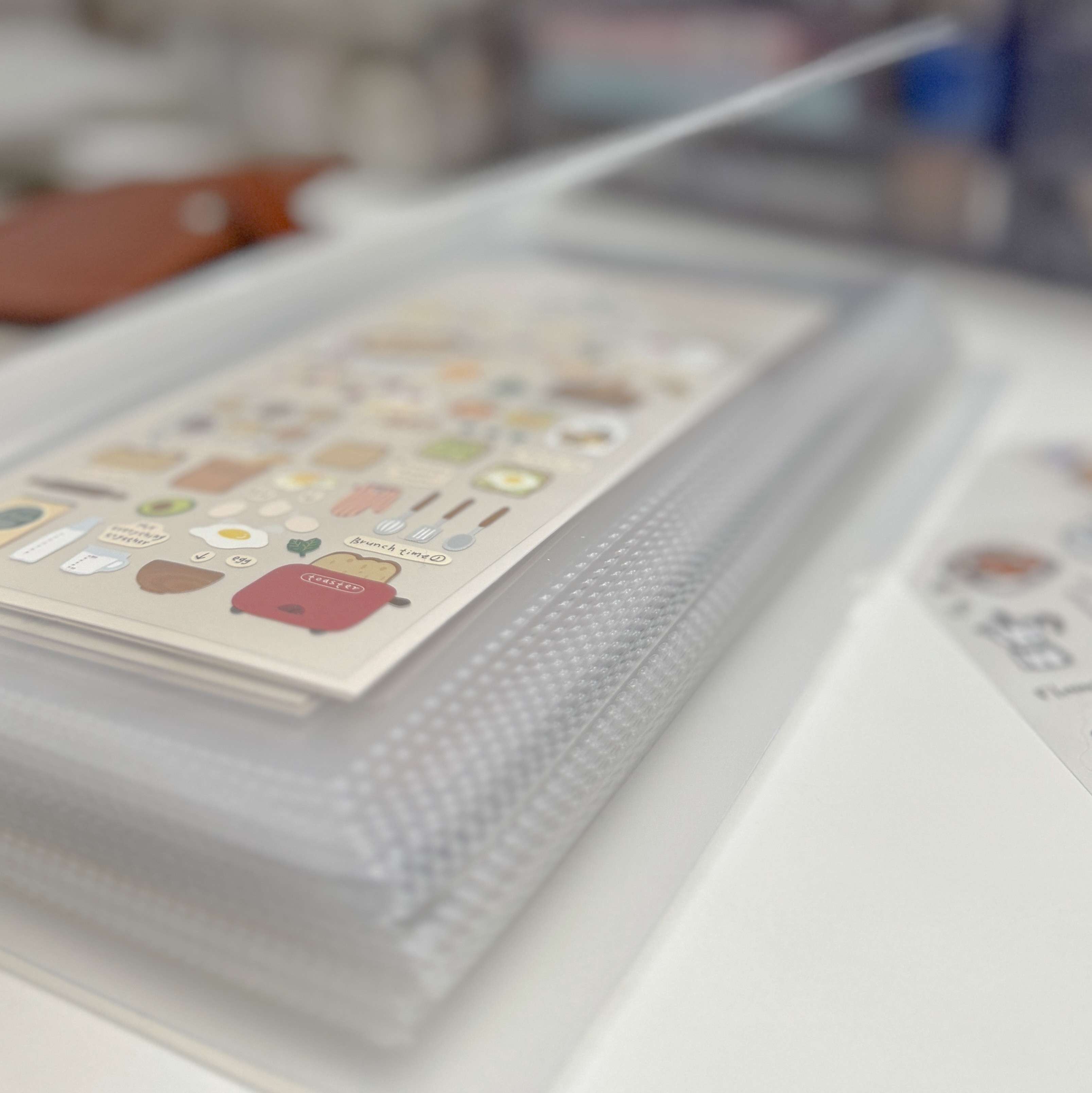 Sticker album with stickers on a white surface