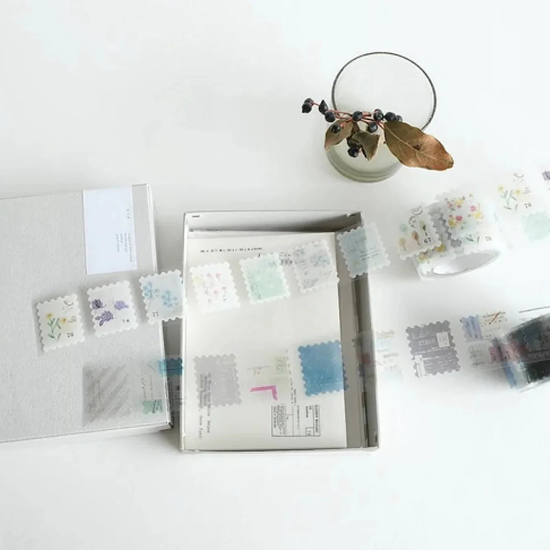 Packaging with decorative stamps on a white surface