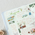 Planner with stickers and text on a light background