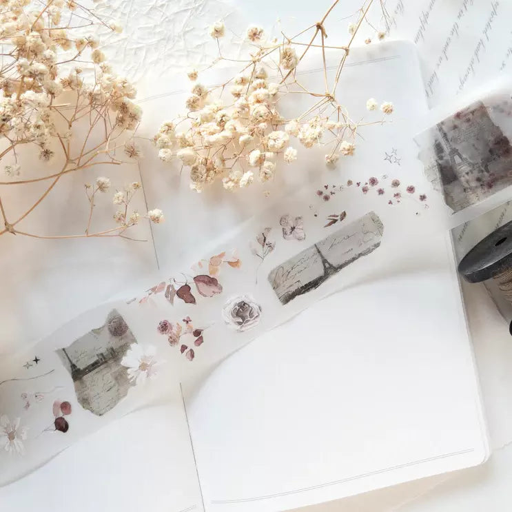 Paper Garden PET Tape floral strip laid with dried flowers on a white surface, top view