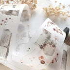 Decorative tape with floral and abstract designs on a white background