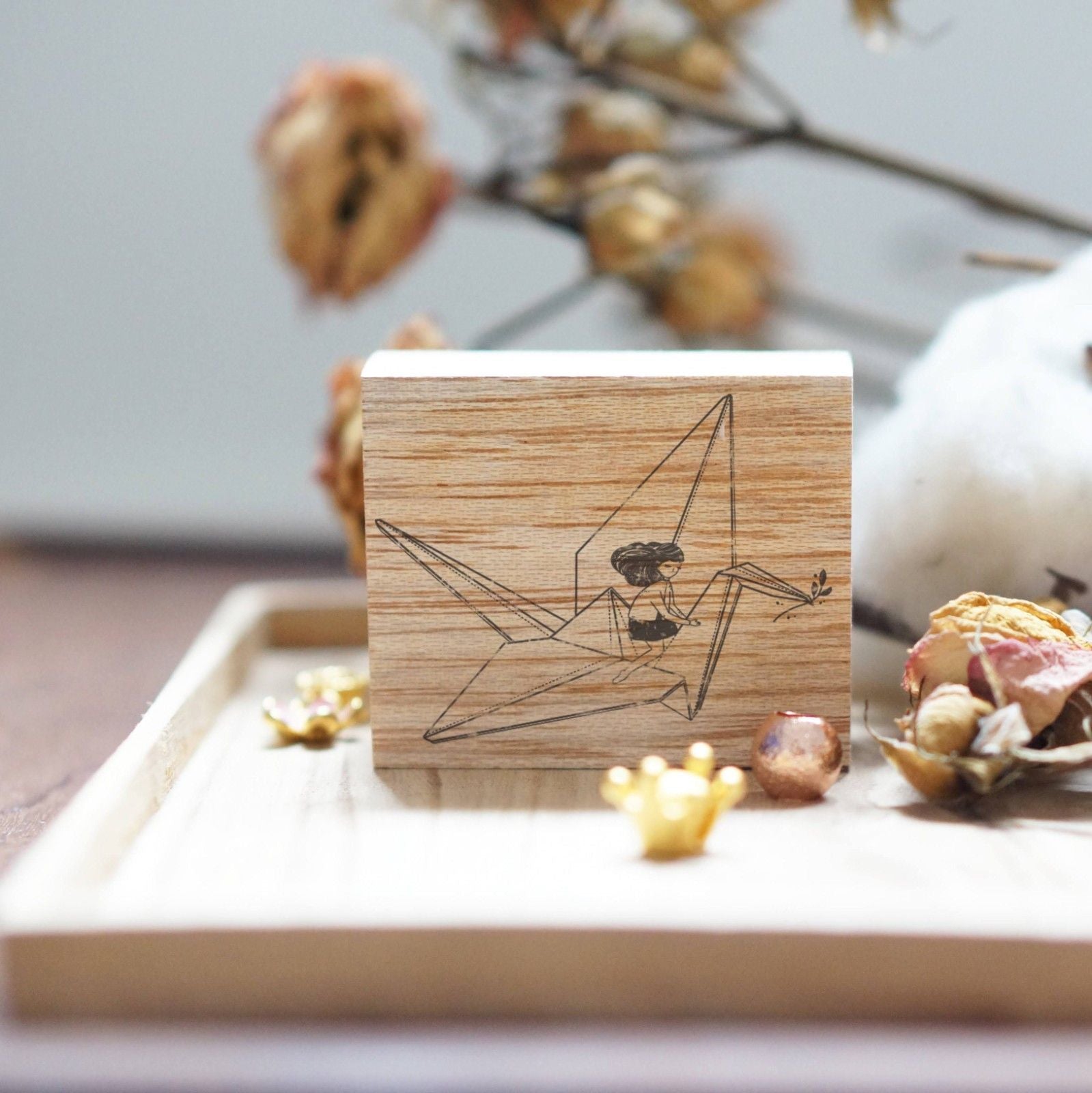 Paper Crane Rubber Stamp by Black Milk Project with a folded origami crane design, product view