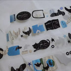Collection of black and blue decorative stickers on a white background