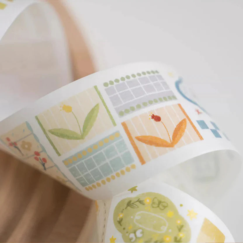 Roll of Patchwork Washi Tape showing its colorful patchwork print on a light background