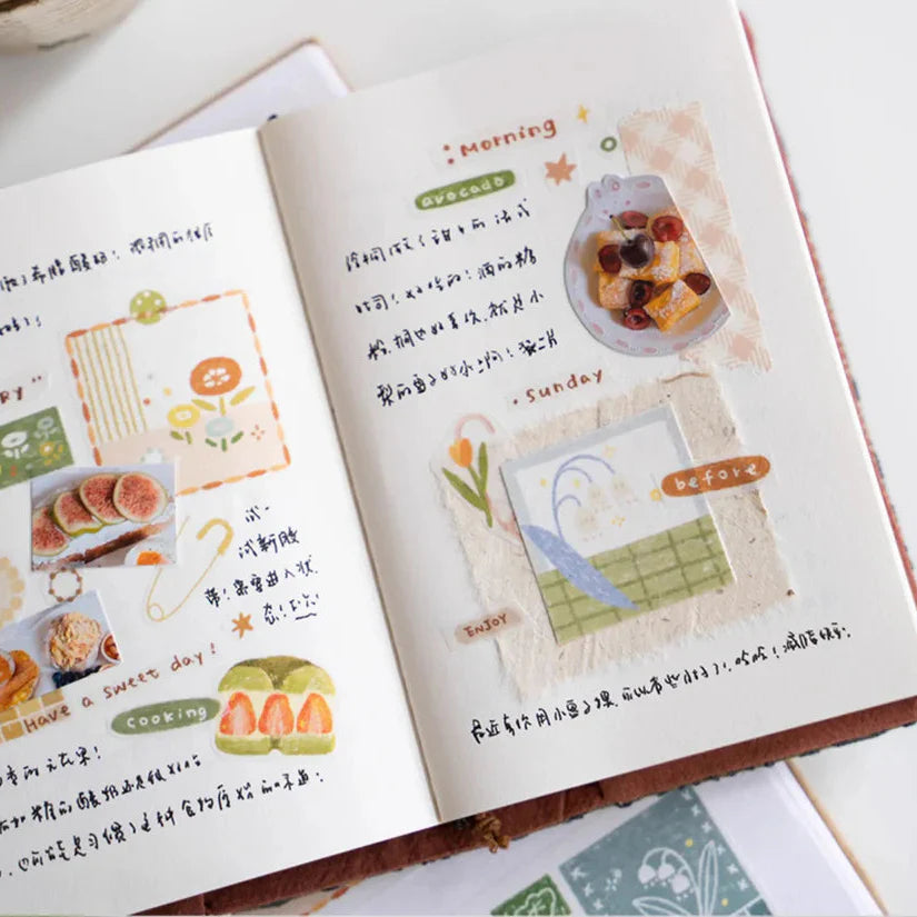 Open book styled with Patchwork Washi Tape illustrated pages and text on a white surface