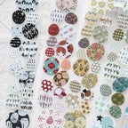 Colorful circular washi tape stickers sheet with floral, geometric, and nature-inspired patterns in soft pastel tones