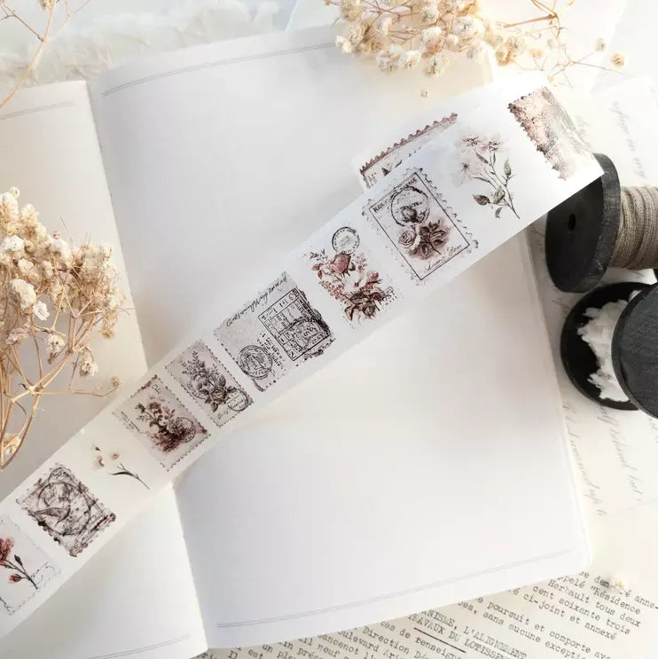 Penny Post Washi Tape floral vintage postal designs with dried flowers on a white surface