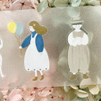 Cute illustration of a girl holding a bouquet of yellow flowers on translucent sticker tape with soft texture.