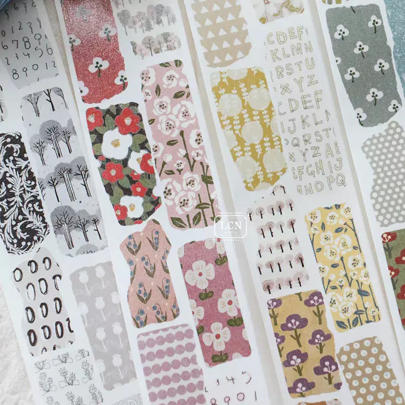 Close-up of Piece of Paper PET Tape vintage florals in red, pink and green on texture