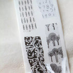 Collection of matte PET tape stickers featuring pastel blue, yellow, and green floral and abstract patterns arranged neatly