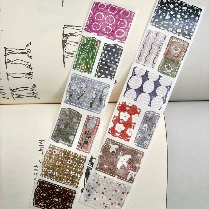 Sheet of patterned stickers with various designs on a white surface.