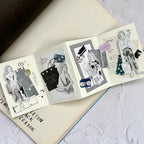 Open book with illustrated pages on a textured surface