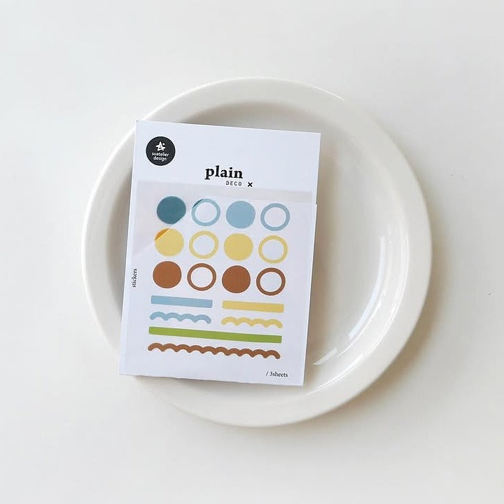 Pack of plain stickers on a white plate with a white background