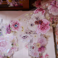 Decorative floral stickers with pink and white flowers on a transparent background.