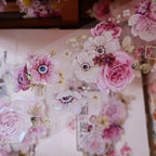 Decorative floral stickers with pink and white flowers on a transparent background.