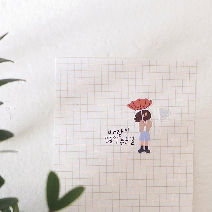Illustration of a person with a red hat on a grid background, from the Rainy Day Sticker Sheet