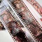 Close-up of a film strip with vintage camera designs.