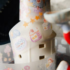 Decorative bottle with colorful stickers on a blurred background