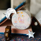 Decorative washi tape with cartoon design on a book