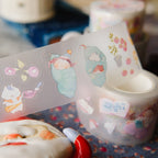 Decorative tape with cartoon designs on a surface