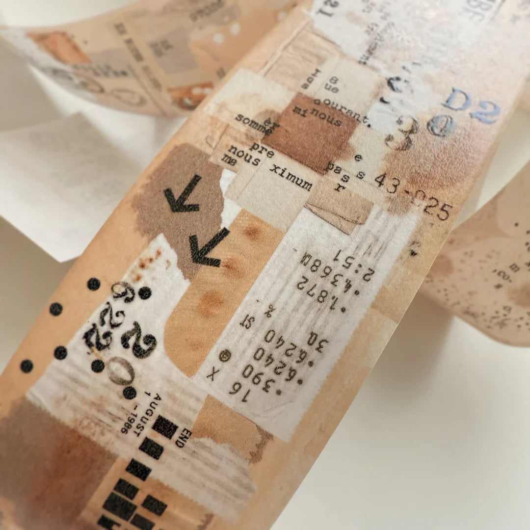 Close-up of a textured paper strip with printed text and symbols on a light background