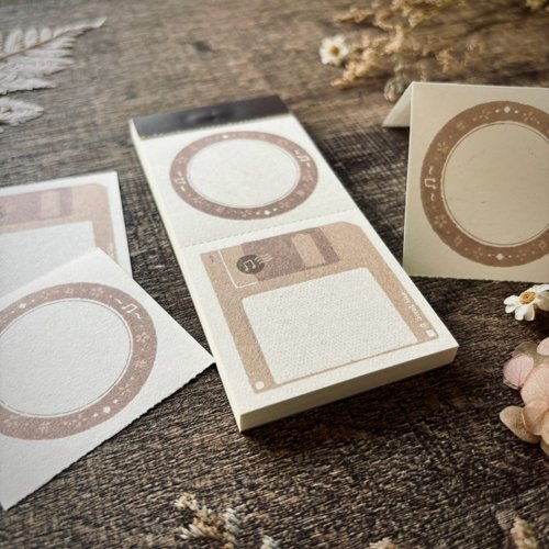 Retro Floppy Disk Memo Pads with vintage disk-inspired covers stacked on a wooden surface