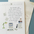 Notebook page with handwritten text and illustrations of a computer, lamp, and books.