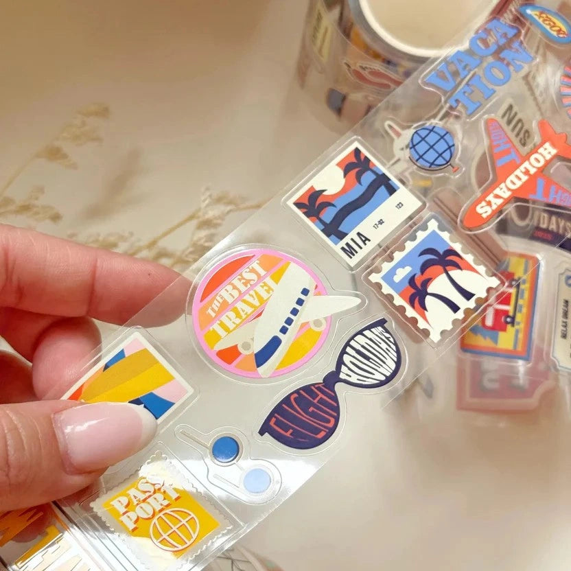 Hand holding a pack of Retro Travel Airline Stamps PET Tape with a blurred background