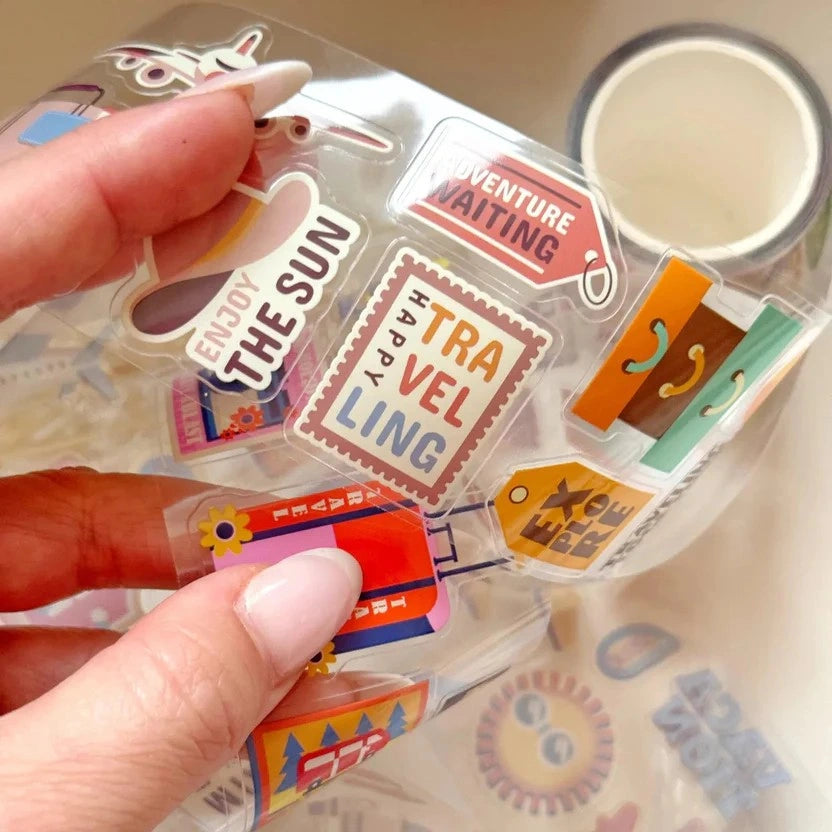Hand holding a clear case of colorful Retro Travel Airline Stamps PET Tape stickers