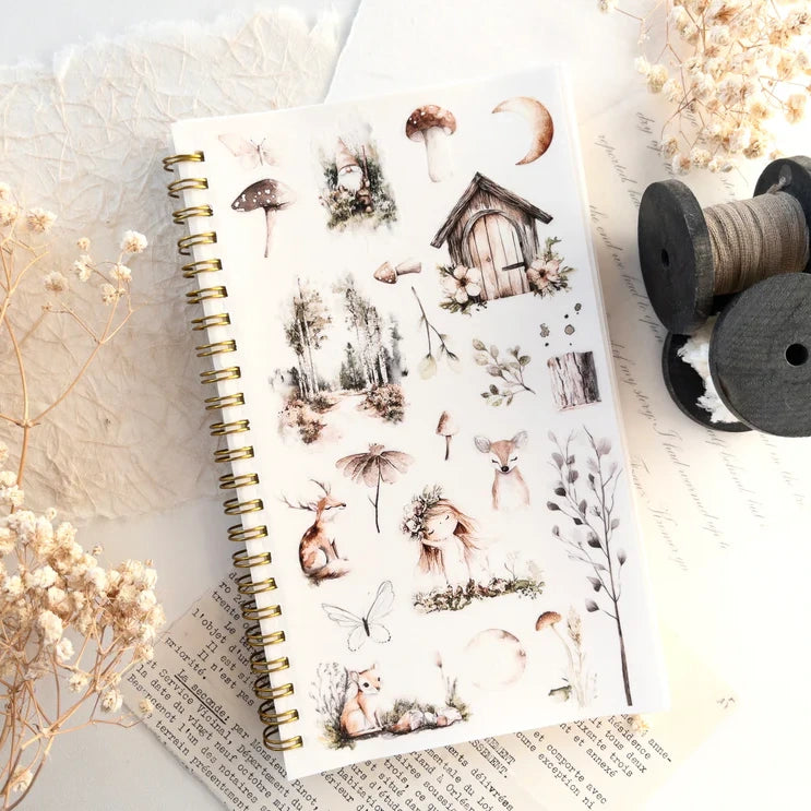 Reusable Sticker Storage Book with nature stickers styled with dried flowers and thread