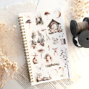 Reusable Sticker Storage Book with nature stickers styled with dried flowers and thread