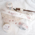 Decorative tape with text and floral designs on a white surface