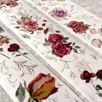 Decorative paper strips with floral designs on a textured surface